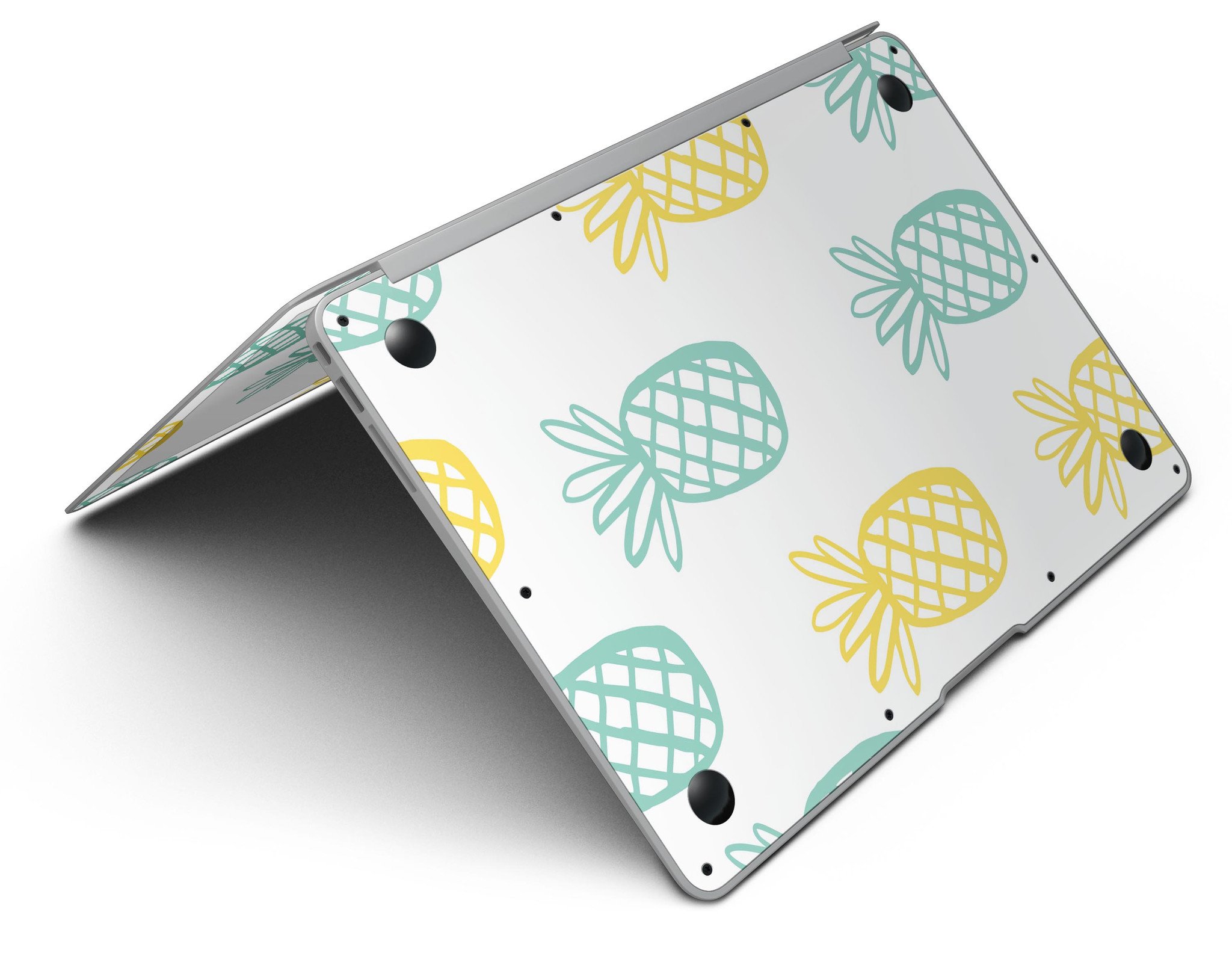 Gold and Mint Pineapple MacBook Air Skin Kit showcasing vibrant design and premium vinyl material.