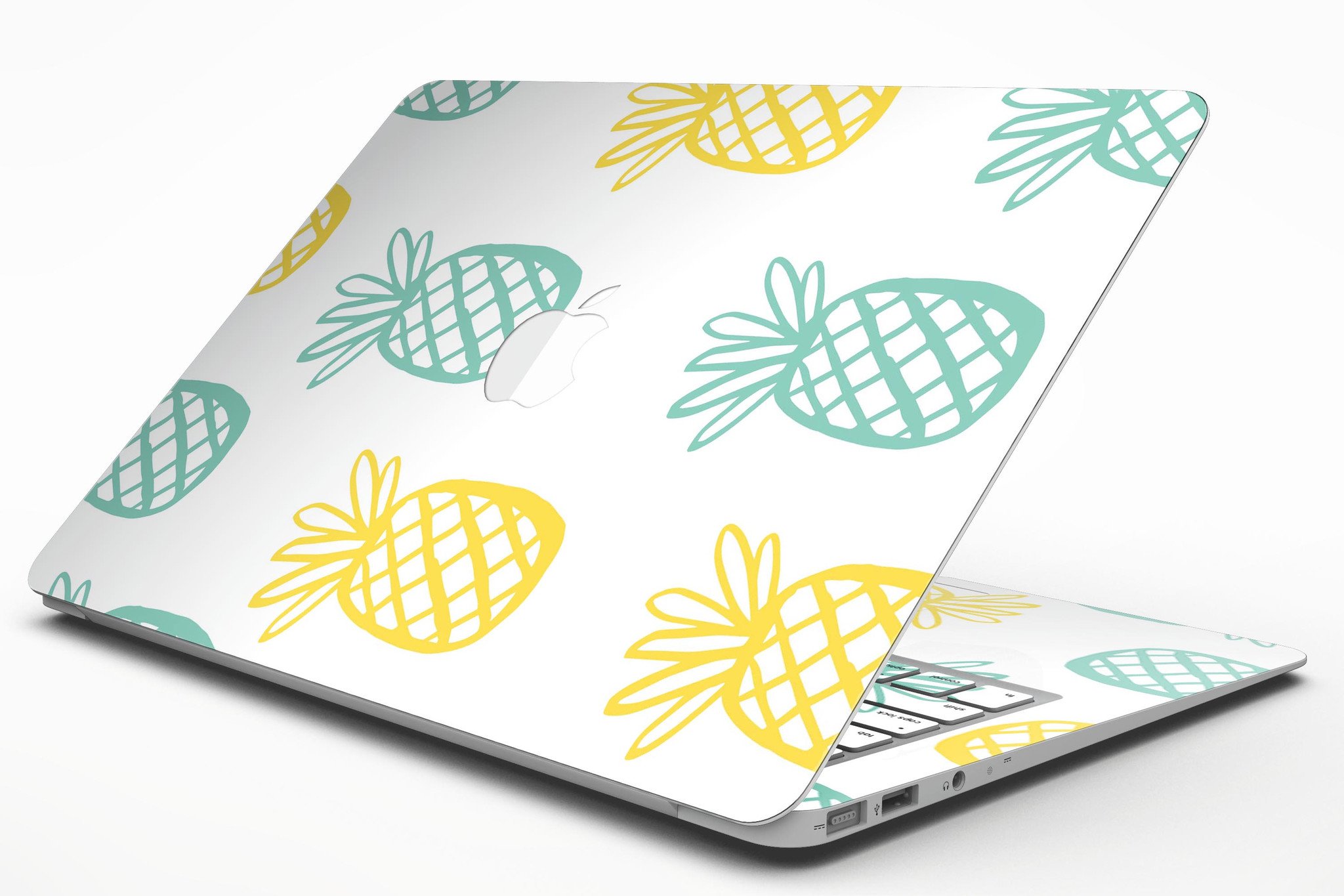 Gold and Mint Pineapple MacBook Air Skin Kit showcasing vibrant design and premium vinyl material.