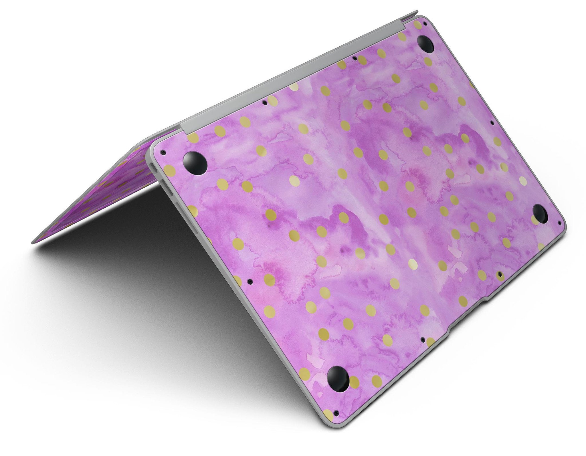 Gold polka dots design on a grungy pink surface MacBook Air skin, showcasing stylish protection.