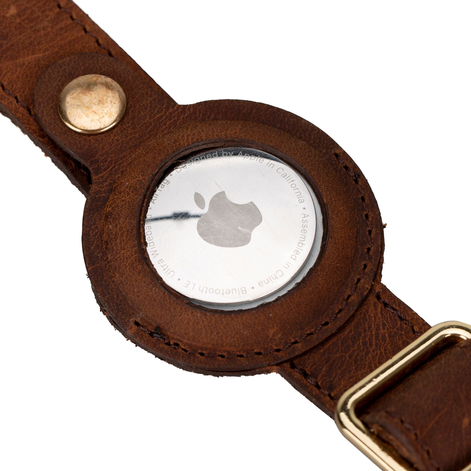 Golden leather dog collar featuring an Apple AirTag slot, crafted from soft cow leather with brass hardware.