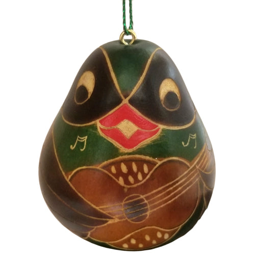 Hand-carved gourd ornament featuring a bird playing a guitar, showcasing intricate designs and craftsmanship from Peruvian artisans.