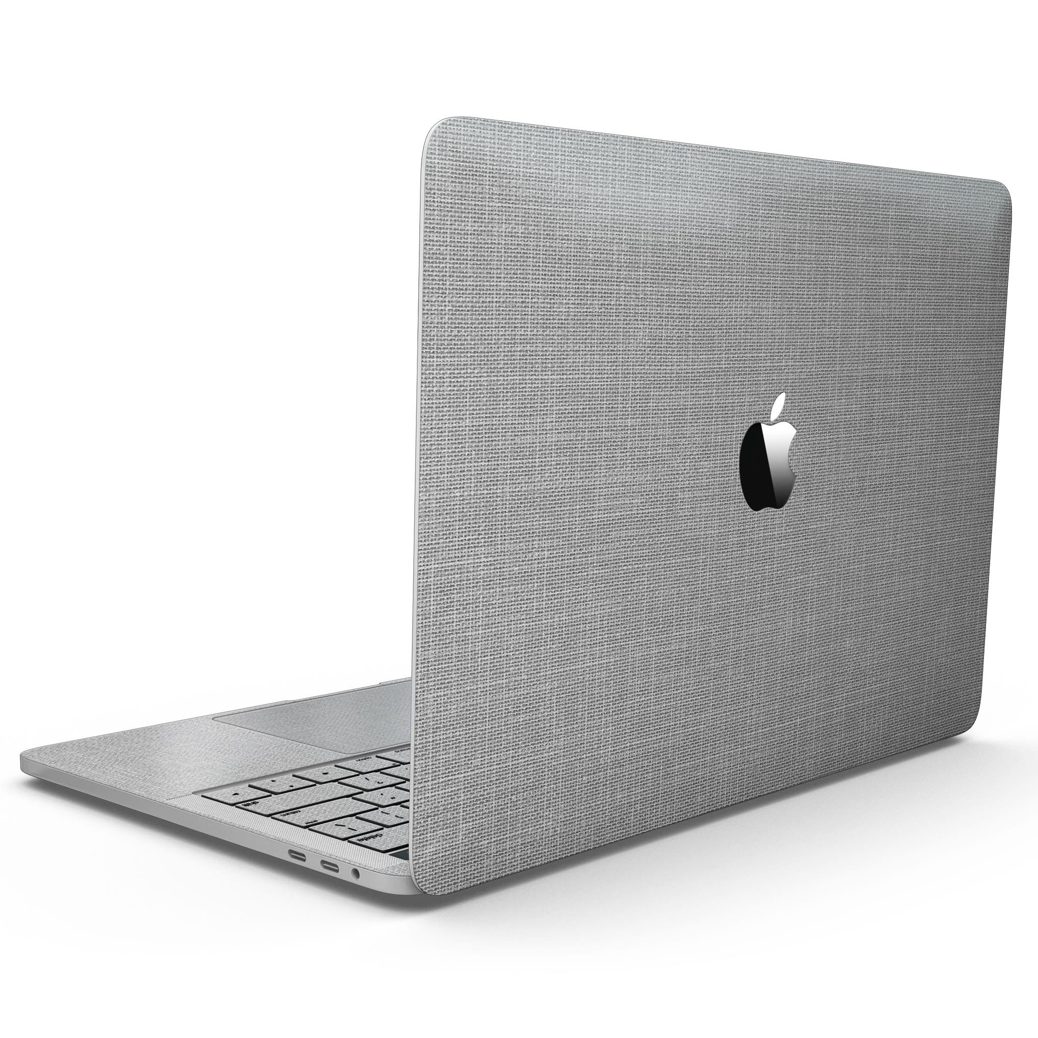 Gray and white scratched fabric skin kit for MacBook Pro with Touch Bar, showcasing a stylish design that protects the device.