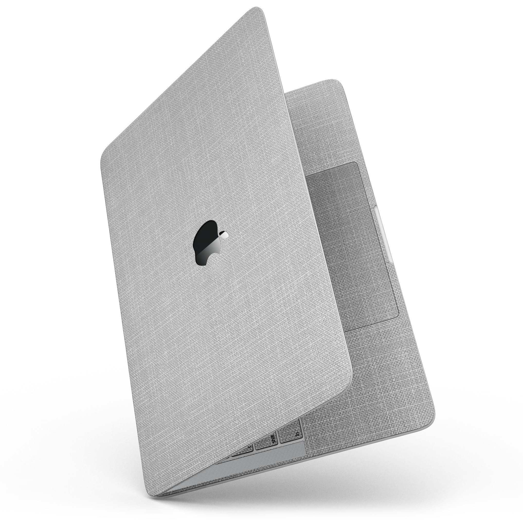 Gray and white scratched fabric skin kit for MacBook Pro with Touch Bar, showcasing a stylish design that protects the device.