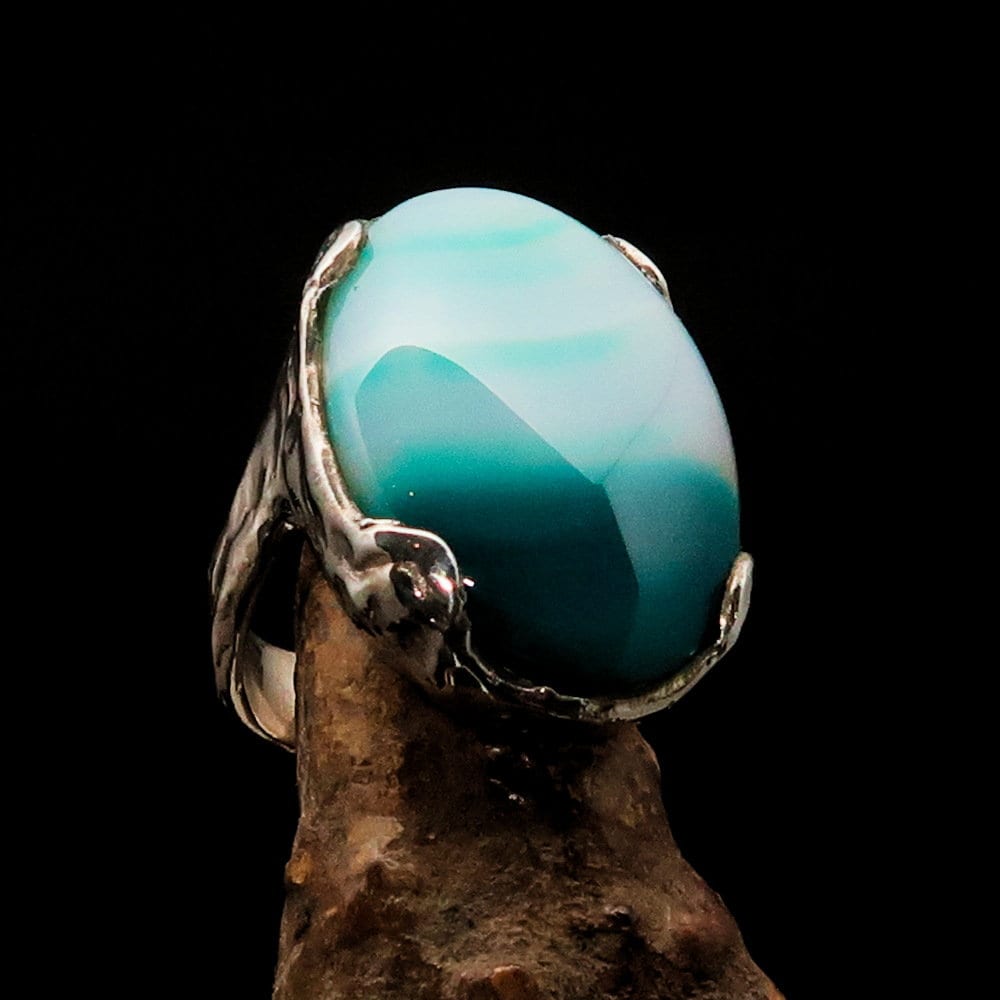 A stunning Green Agate silver ring featuring a green and white Agate Cabochon set in polished Sterling Silver, showcasing its unique design.