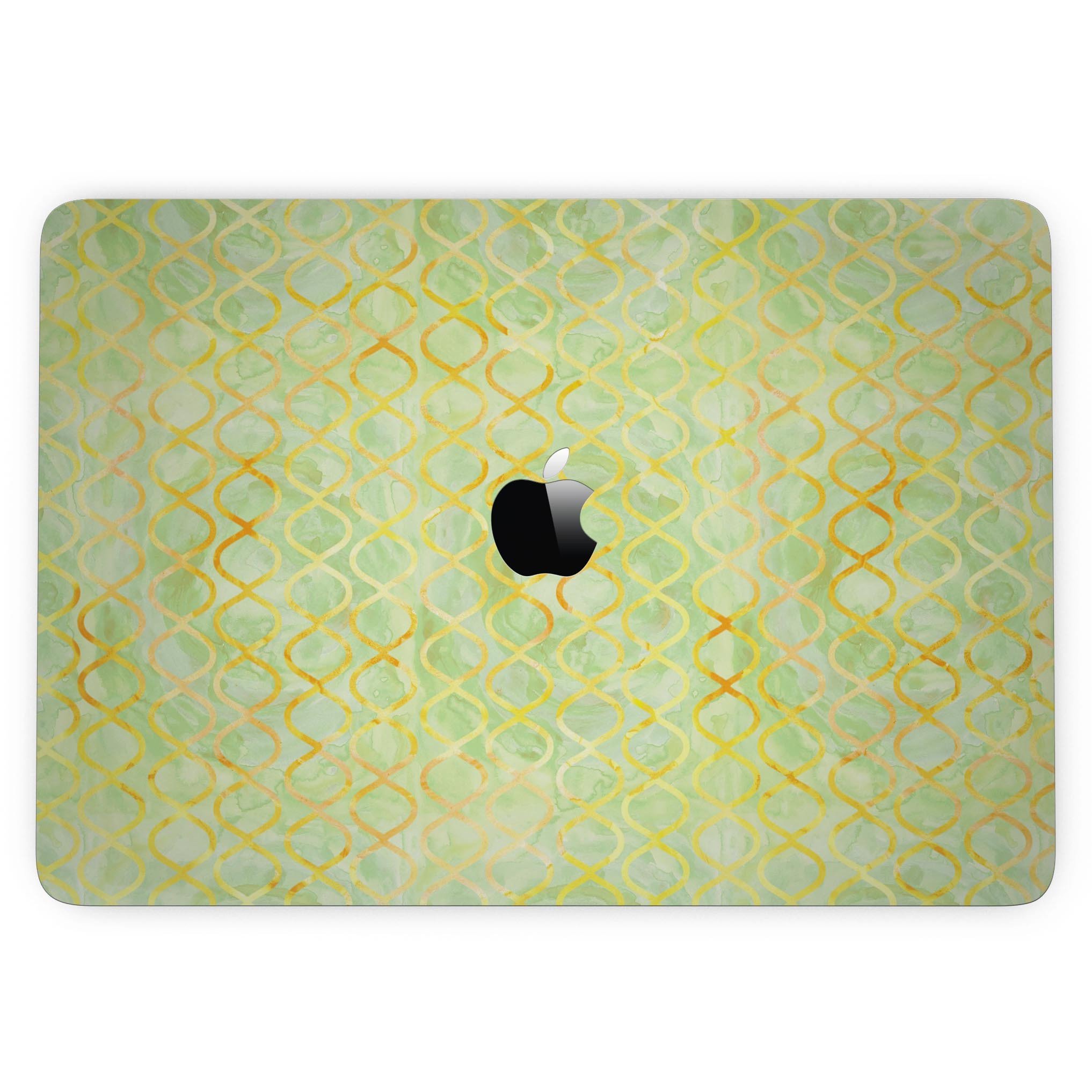 A 13" MacBook Pro with a Green and Yellow Watercolor Helix Pattern skin, showcasing vibrant colors and a sleek design.