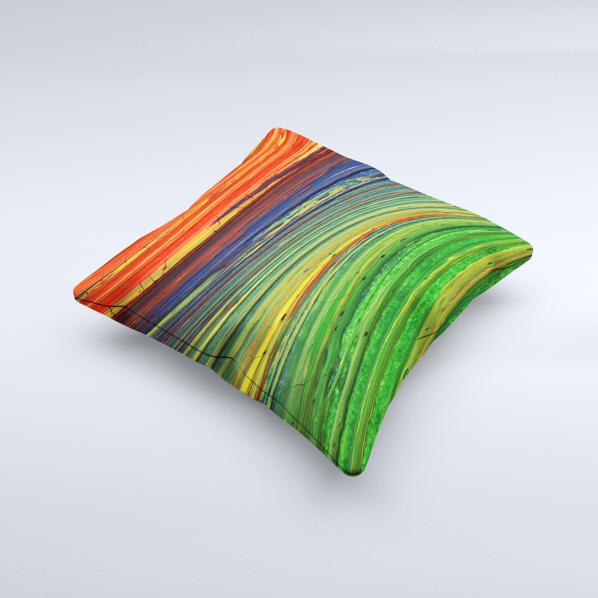 A vibrant decorative throw pillow featuring green, blue, and red painted oil waves, handcrafted in Virginia with a unique ink-fuzed design.