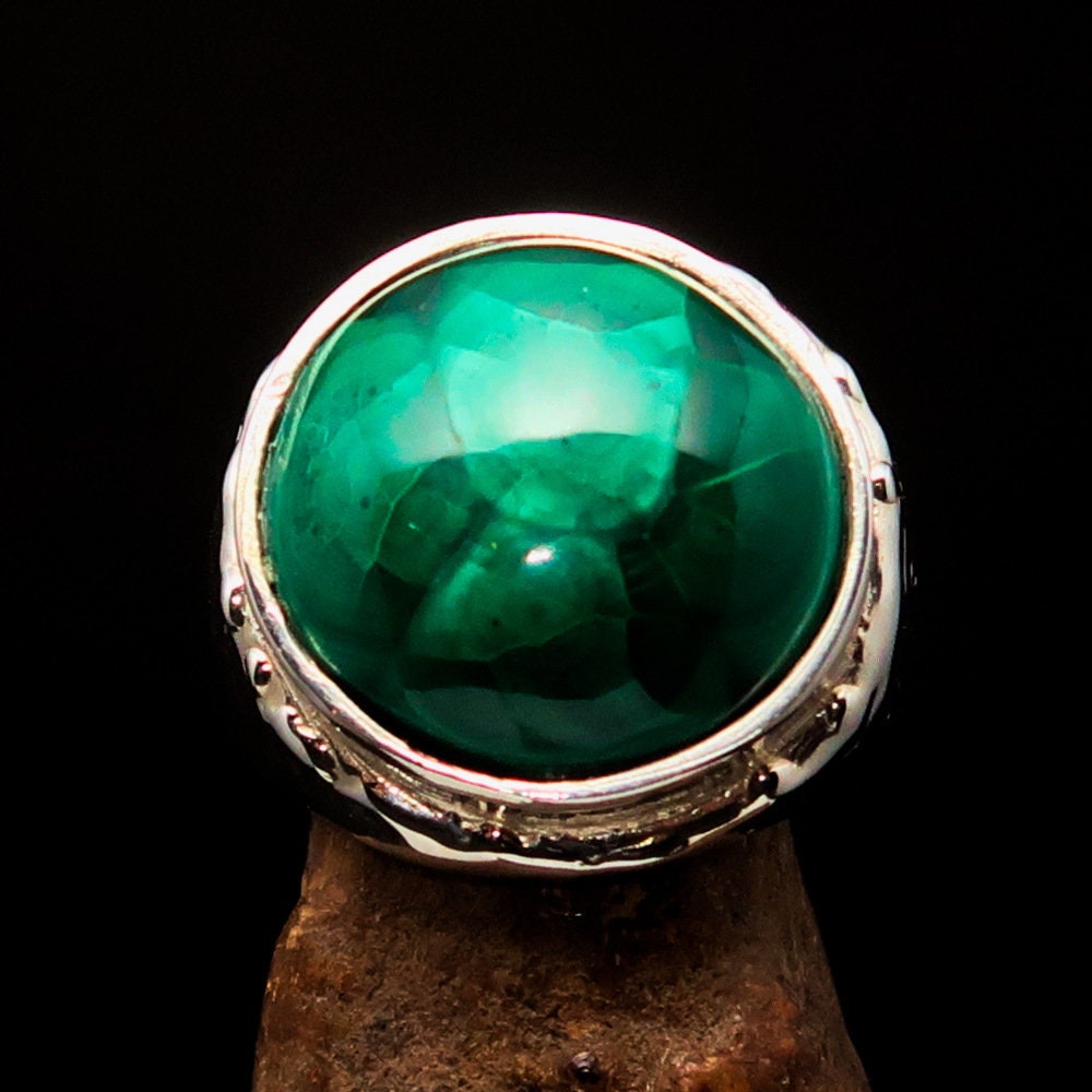 Handmade silver ring featuring a round green Malachite stone, polished to perfection, showcasing vibrant green hues.