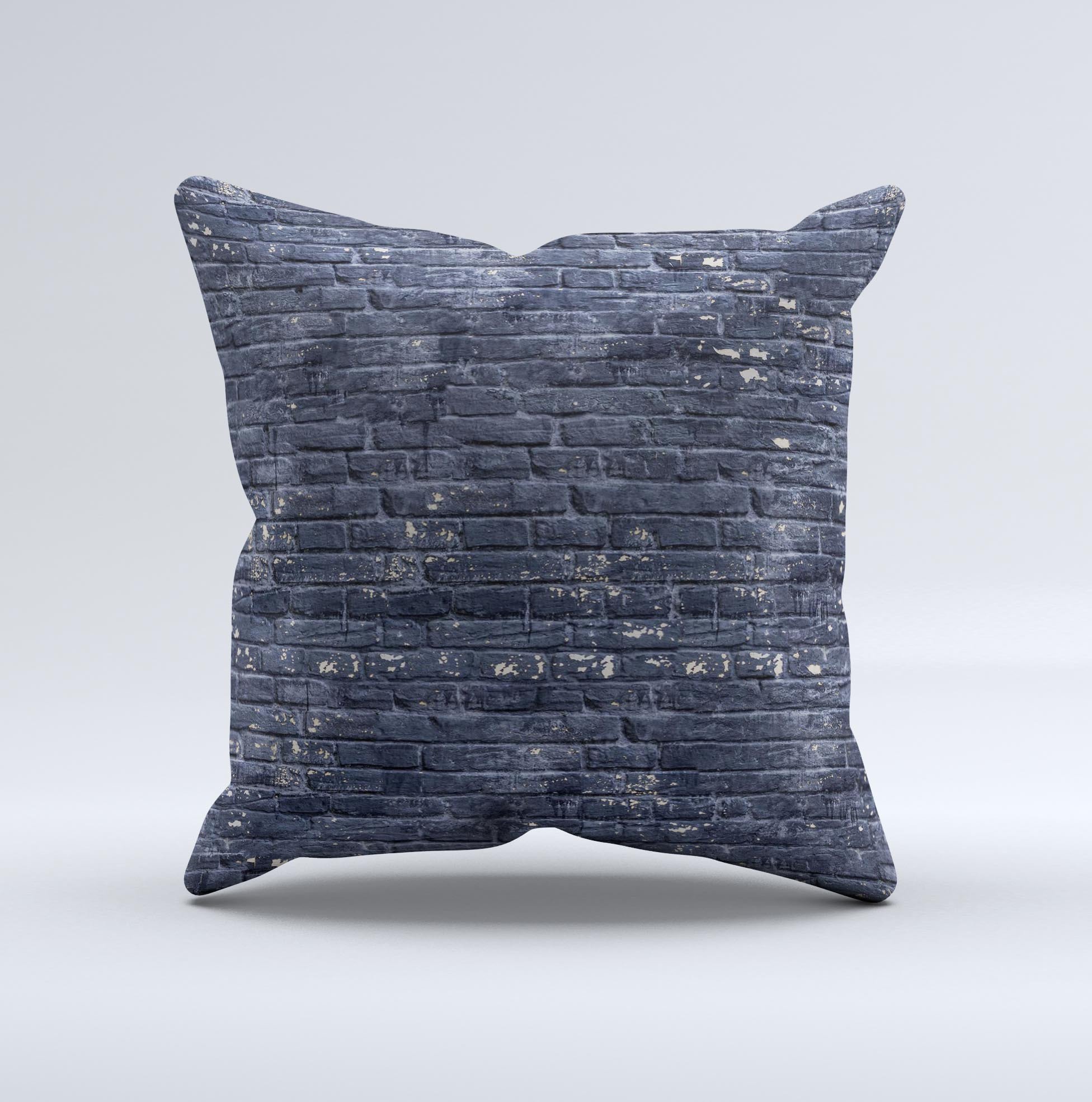 Grungy dark blue decorative throw pillow featuring a brick wall design, showcasing unique handmade characteristics.