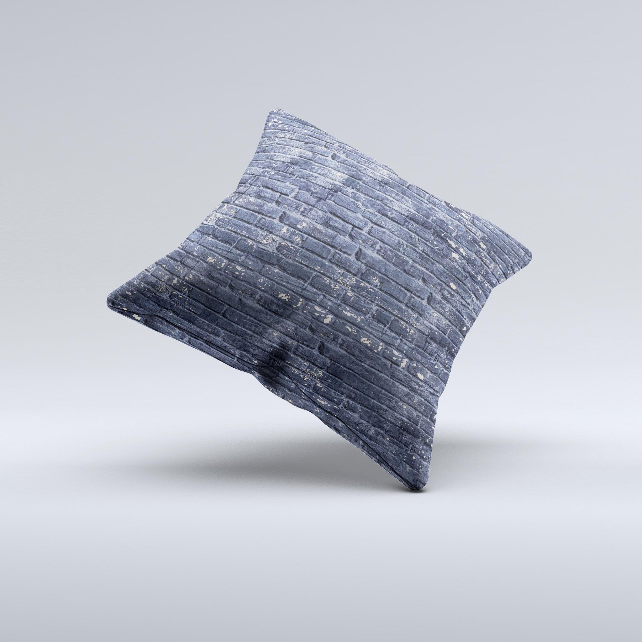 Grungy dark blue decorative throw pillow featuring a brick wall design, showcasing unique handmade characteristics.