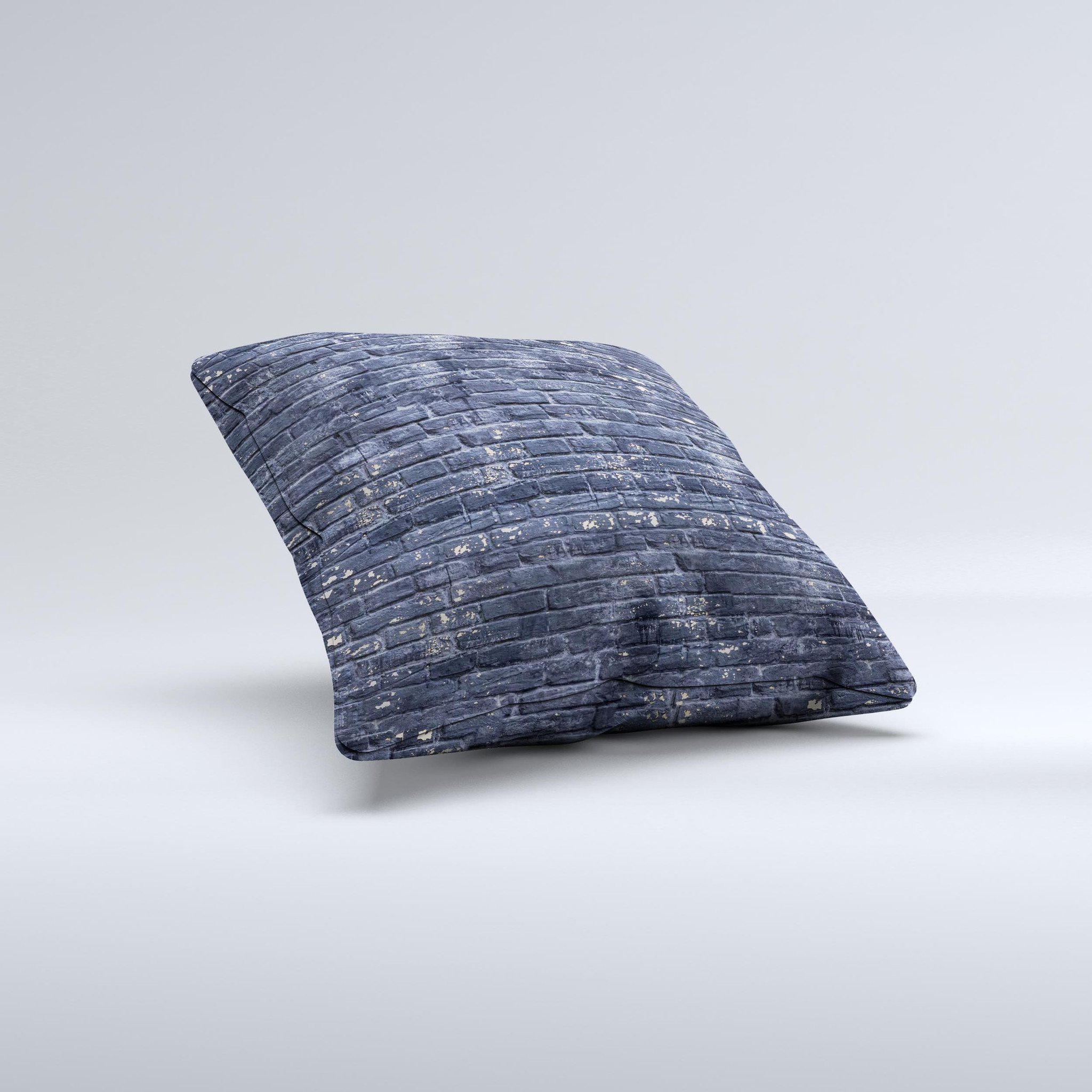 Grungy dark blue decorative throw pillow featuring a brick wall design, showcasing unique handmade characteristics.