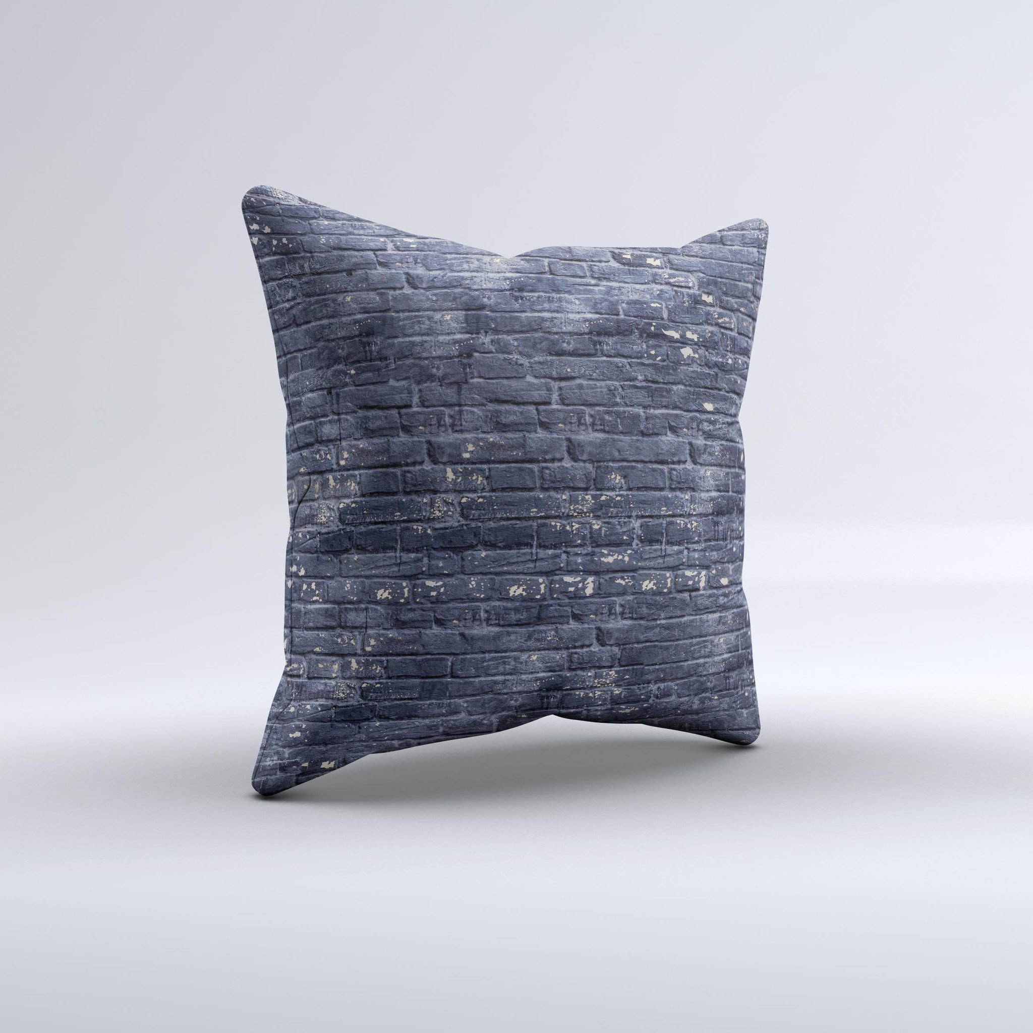 Grungy dark blue decorative throw pillow featuring a brick wall design, showcasing unique handmade characteristics.