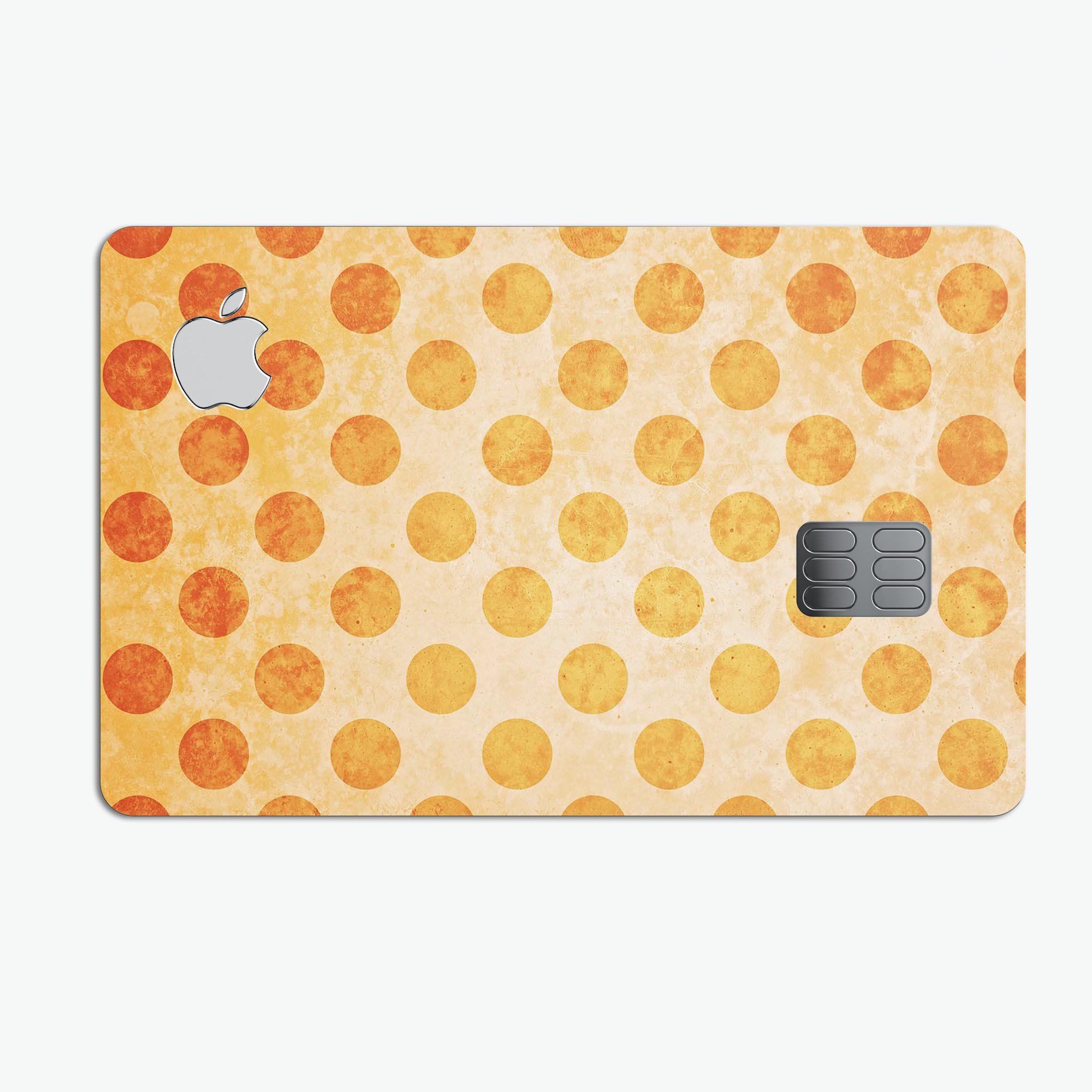 Grungy orange polka dots decal on a muted coral background, designed for Apple Card protection.