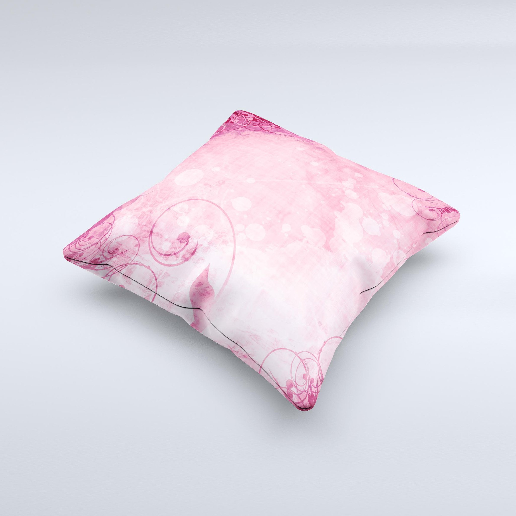 A handcrafted decorative throw pillow featuring a grungy pink painted swirl pattern, showcasing unique design and high-quality fabric.