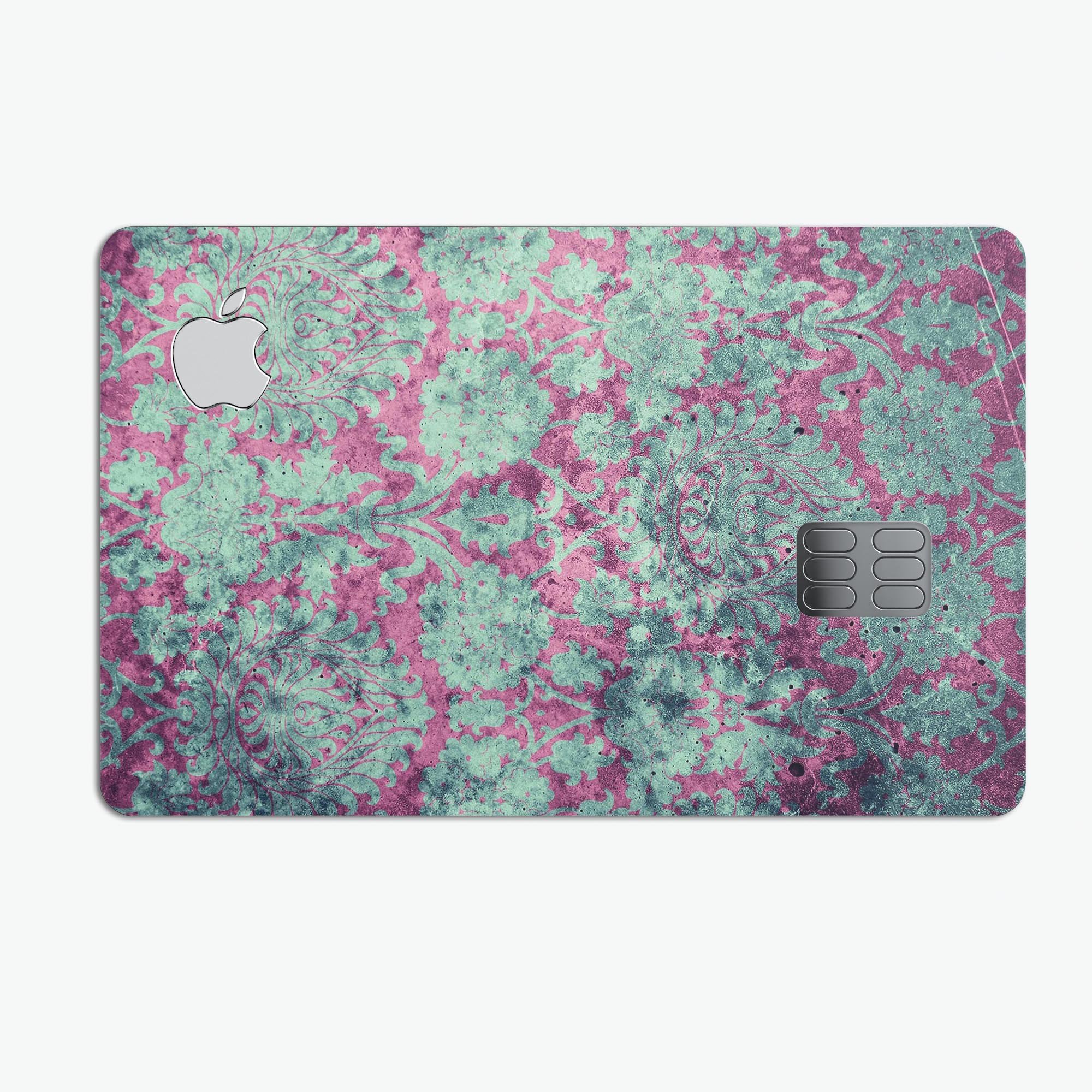 Grungy teal and pink damask pattern protective decal for Apple Card, showcasing vibrant colors and intricate design.