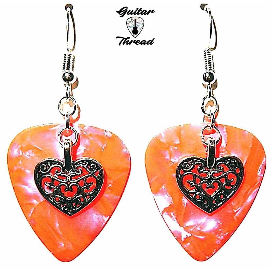 Colorful handmade guitar pick dangle earrings with sterling silver hooks, showcasing a unique and fun design.