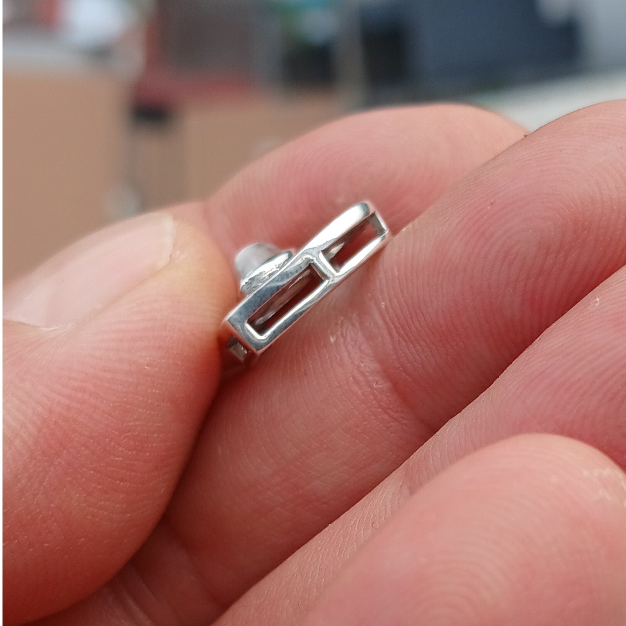 Sterling silver heart pendant featuring a Ceylon moonstone, elegantly designed with a shimmering finish.