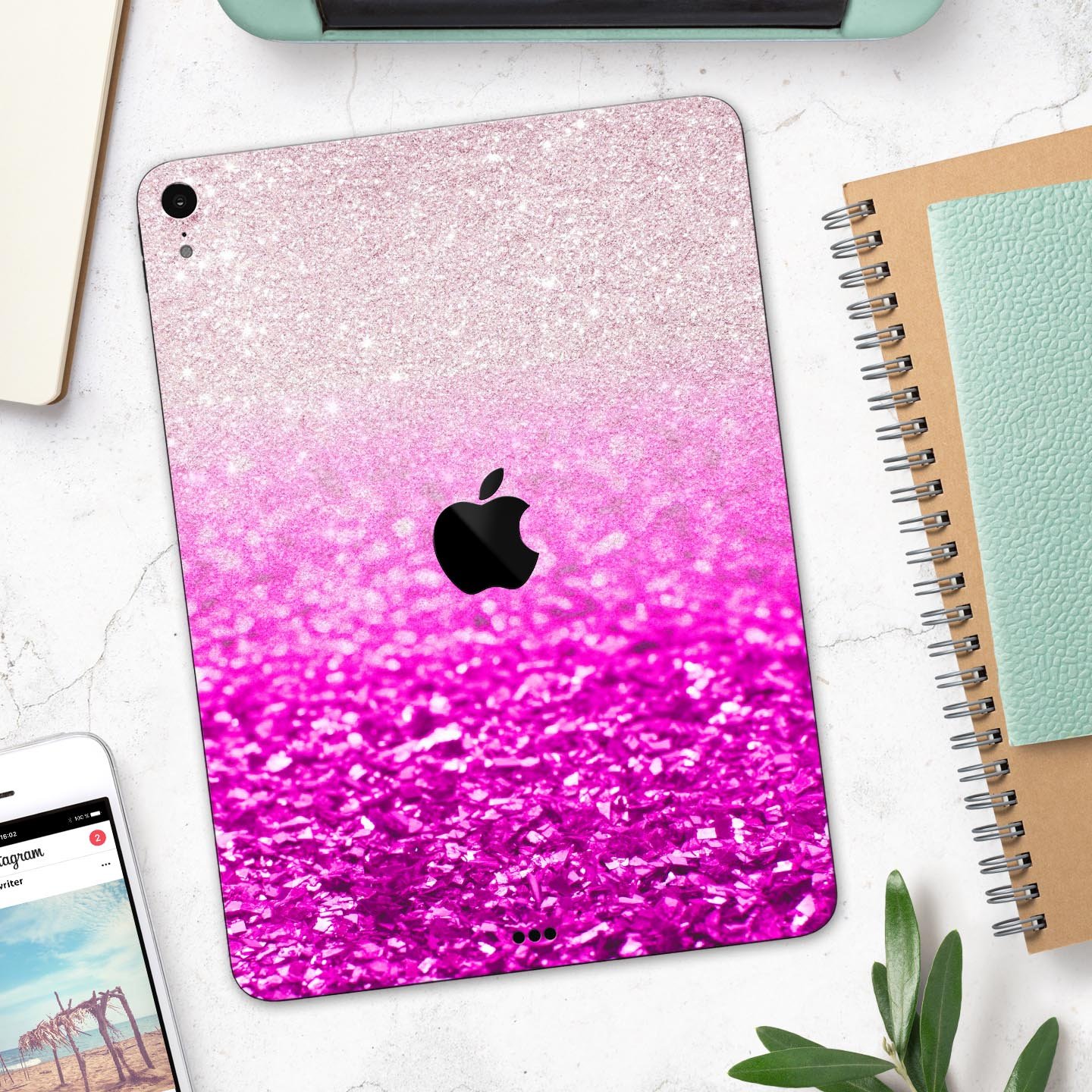 Pink glittery iPad on desk.