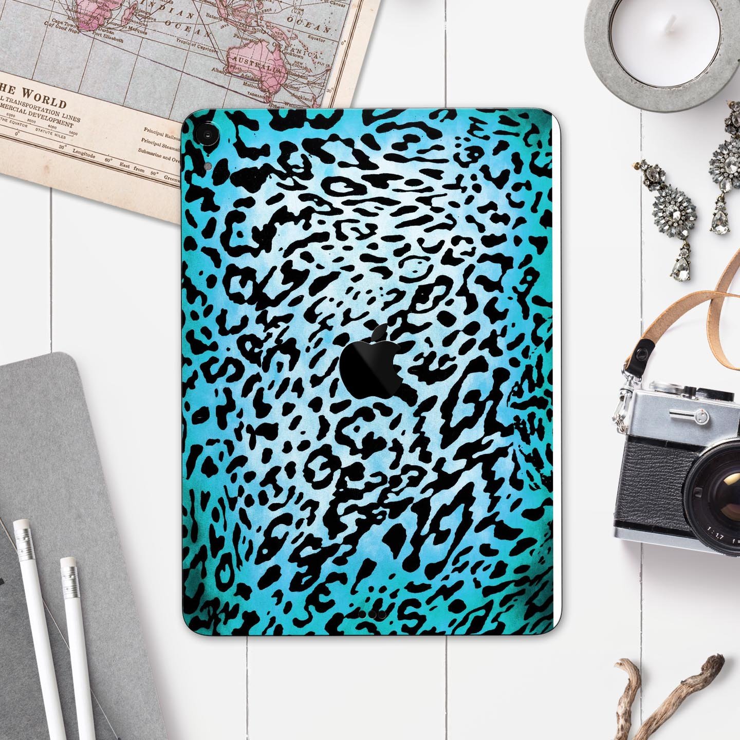 Hot teal cheetah animal print full body skin decal for Apple devices, showcasing vibrant colors and sleek design.