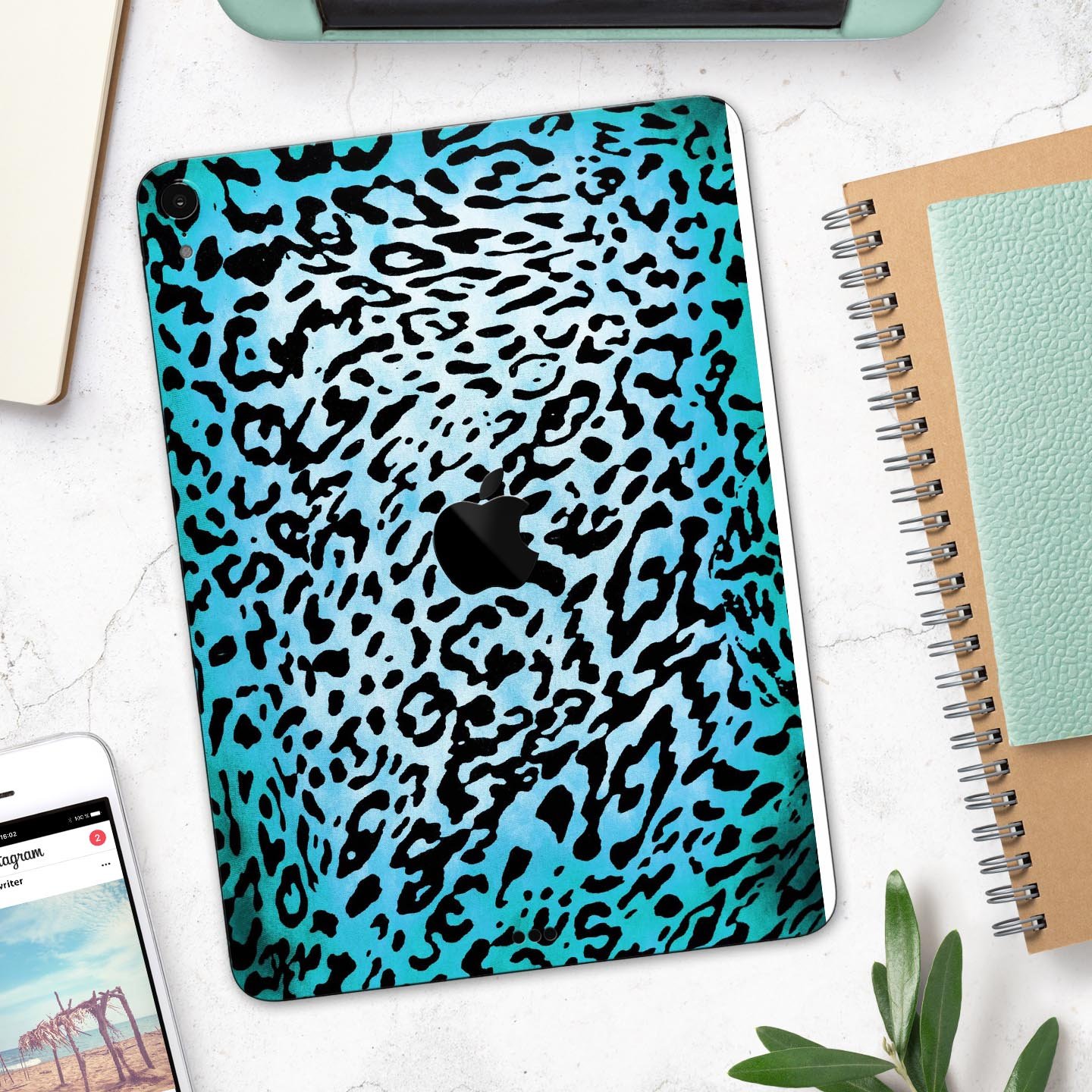 Hot teal cheetah animal print full body skin decal for Apple devices, showcasing vibrant colors and sleek design.