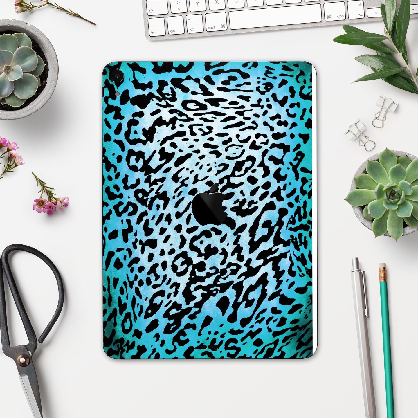 Hot teal cheetah animal print full body skin decal for Apple devices, showcasing vibrant colors and sleek design.