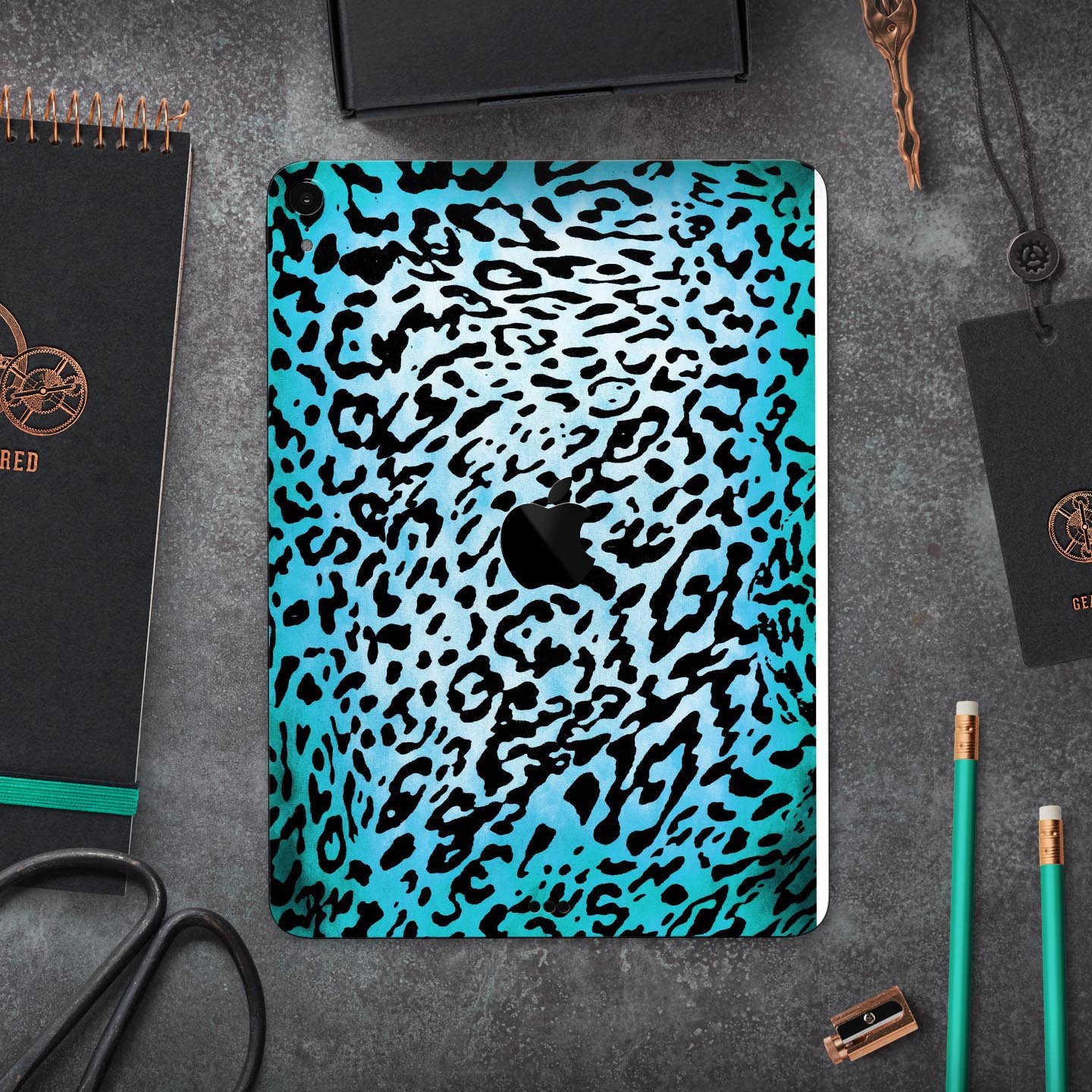 Hot teal cheetah animal print full body skin decal for Apple devices, showcasing vibrant colors and sleek design.