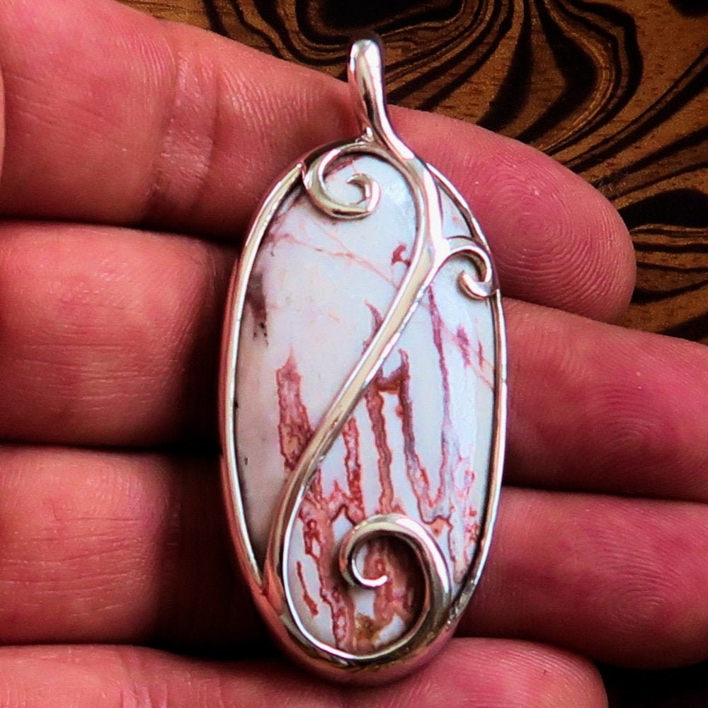 A beautiful Jasper Amulet pendant made of sterling silver, featuring a pear-shaped Jasper gemstone, hallmarked 925, showcasing intricate craftsmanship.