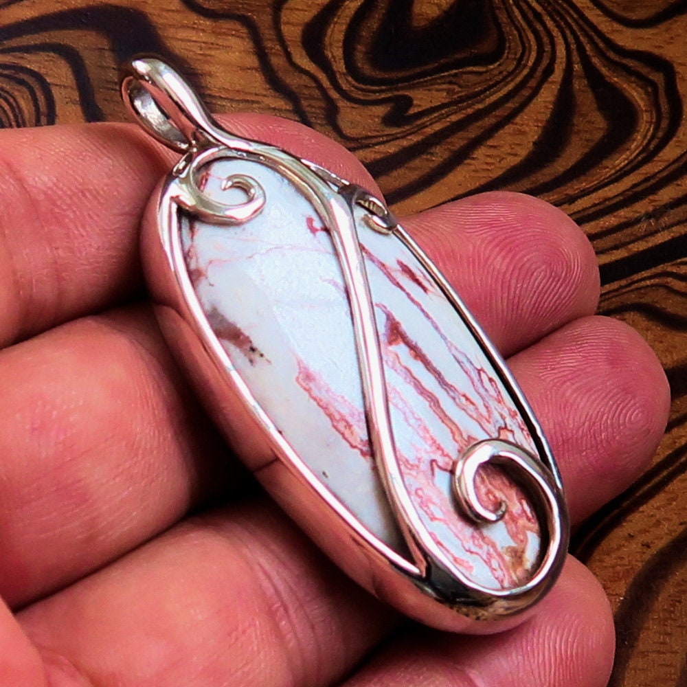 A beautiful Jasper Amulet pendant made of sterling silver, featuring a pear-shaped Jasper gemstone, hallmarked 925, showcasing intricate craftsmanship.