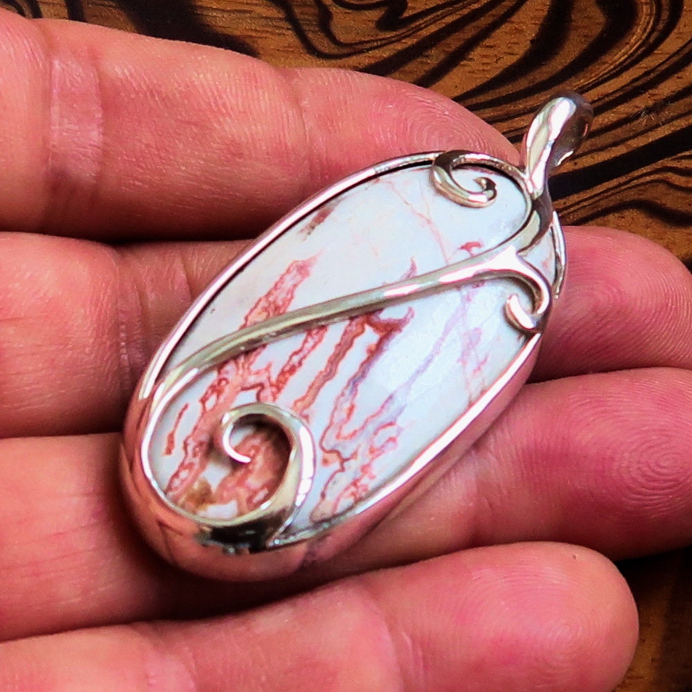 A beautiful Jasper Amulet pendant made of sterling silver, featuring a pear-shaped Jasper gemstone, hallmarked 925, showcasing intricate craftsmanship.