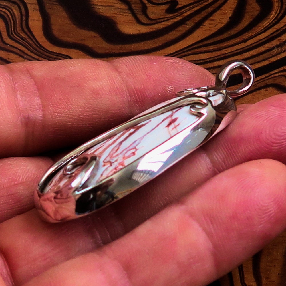 A beautiful Jasper Amulet pendant made of sterling silver, featuring a pear-shaped Jasper gemstone, hallmarked 925, showcasing intricate craftsmanship.