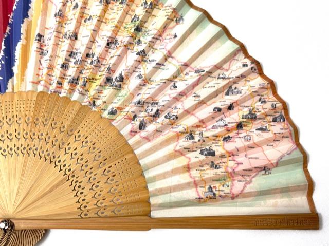 Journey to Armenia Hand Fan with bamboo ribs and shimmery brown tassel, displayed elegantly.