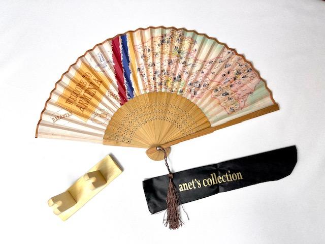 Journey to Armenia Hand Fan with bamboo ribs and shimmery brown tassel, displayed elegantly.