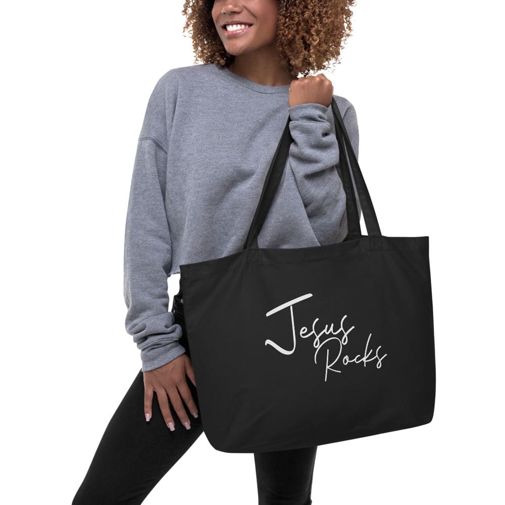 Large black tote bag with Jesus Rocks inspirational print, featuring durable cotton material and spacious design.