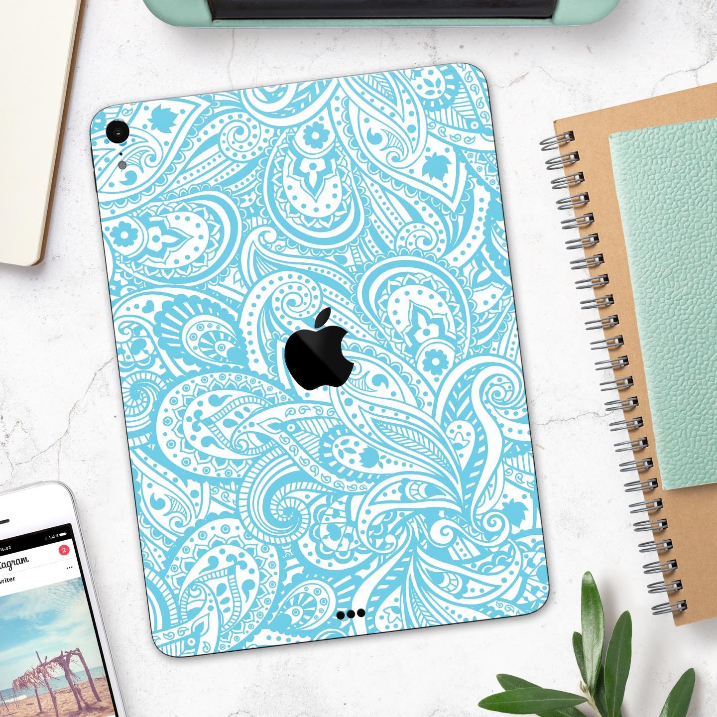 Light Blue Paisley Floral Full Body Skin Decal for Apple iPad, showcasing intricate floral patterns on a sleek surface.