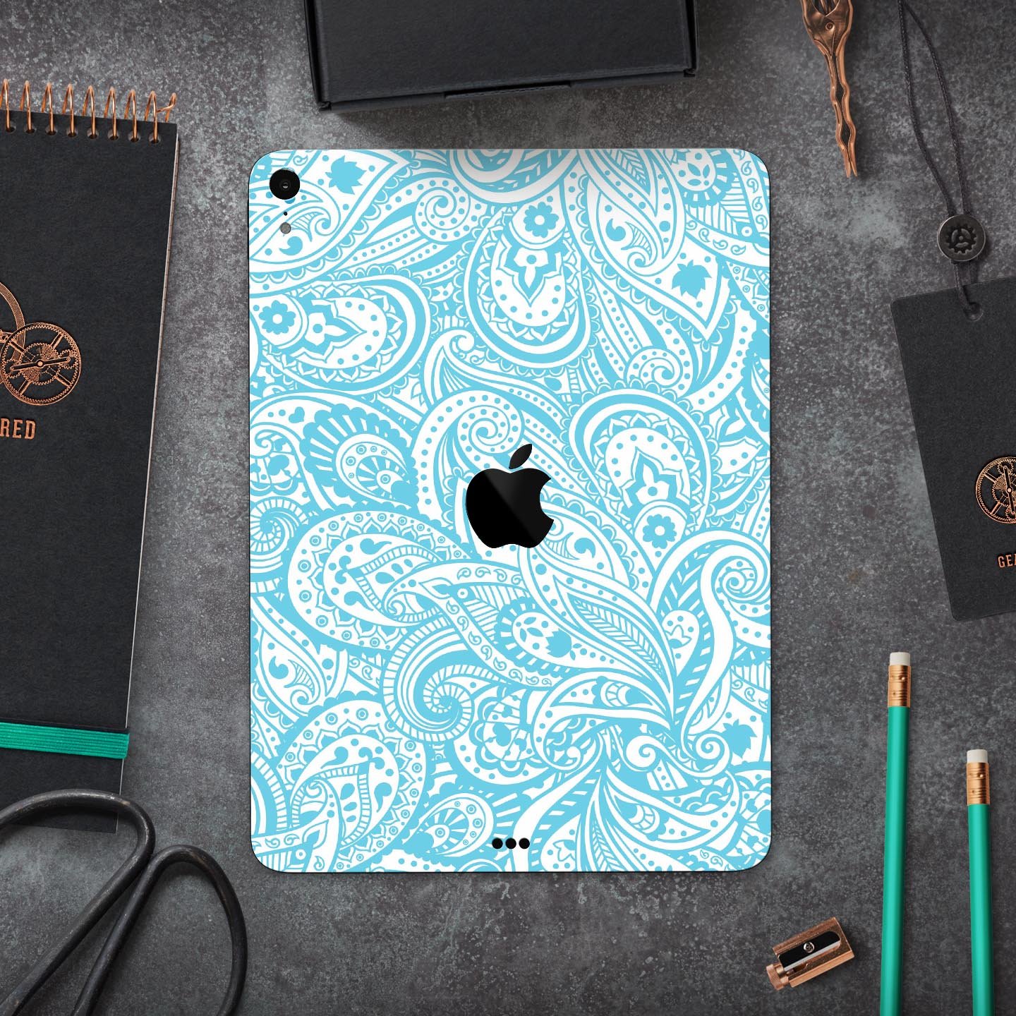 Light Blue Paisley Floral Full Body Skin Decal for Apple iPad, showcasing intricate floral patterns on a sleek surface.