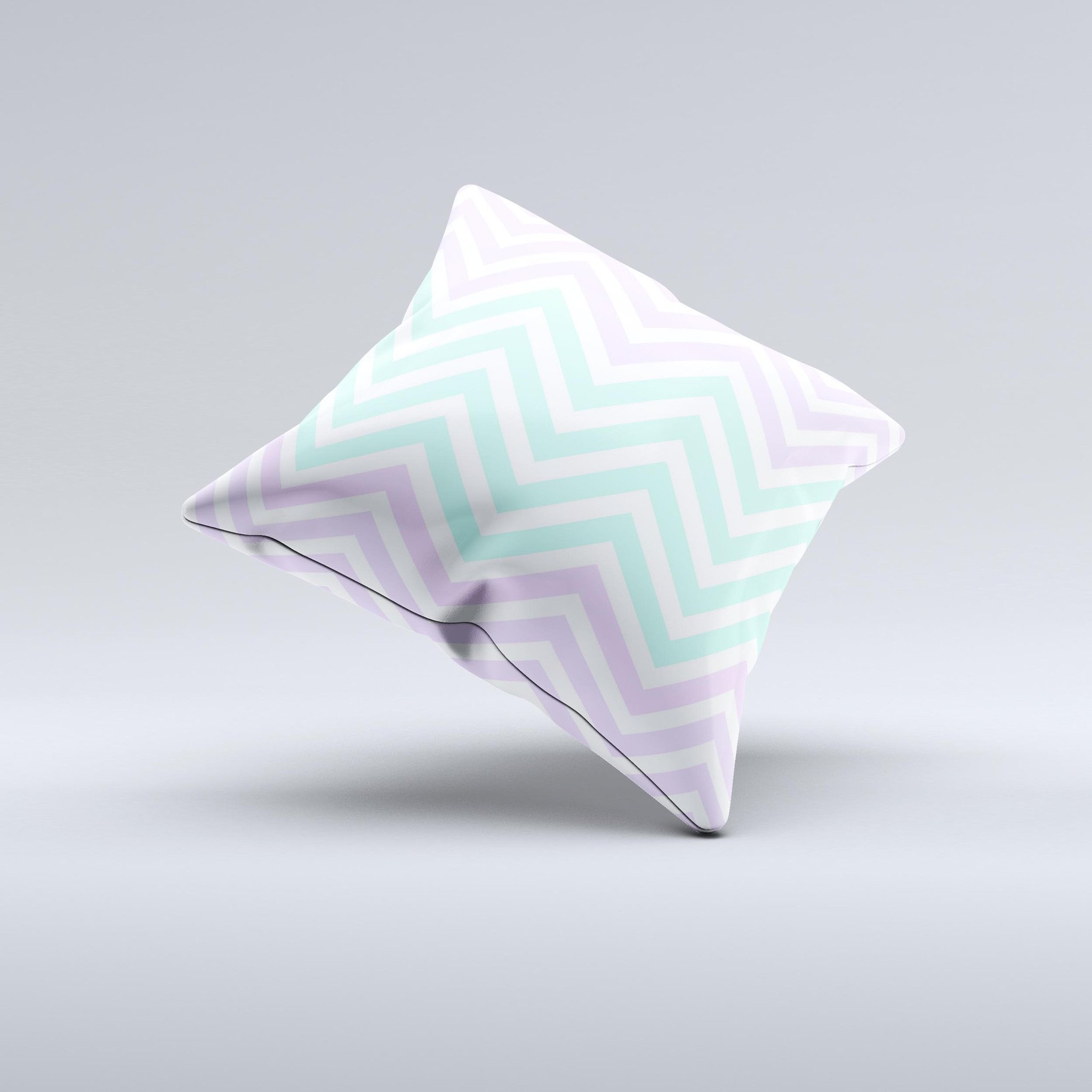 Light teal and purple decorative throw pillow featuring a sharp chevron pattern, handcrafted in Virginia with high-quality materials.