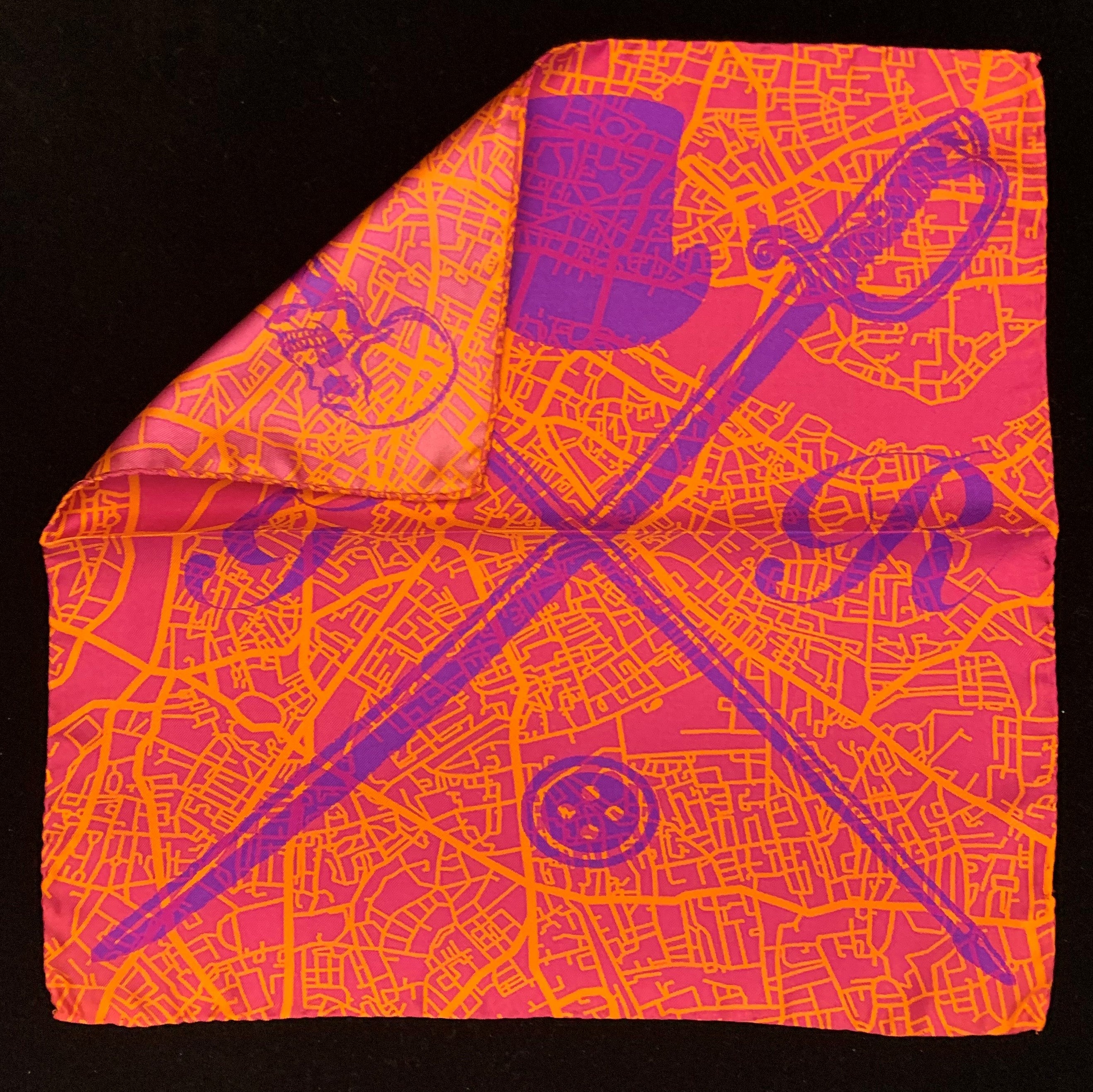 London Street Map Orange Pocket Square featuring a vibrant orange design with a detailed map of London and the Gentleman Rogue logo.