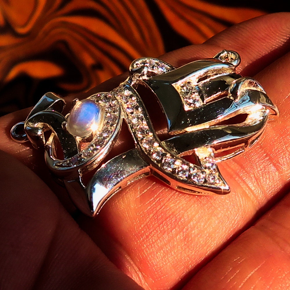 Sterling silver Love Pendant featuring a moonstone centerpiece and cubic zirconia accents, elegantly designed with the word 'LOVE'.