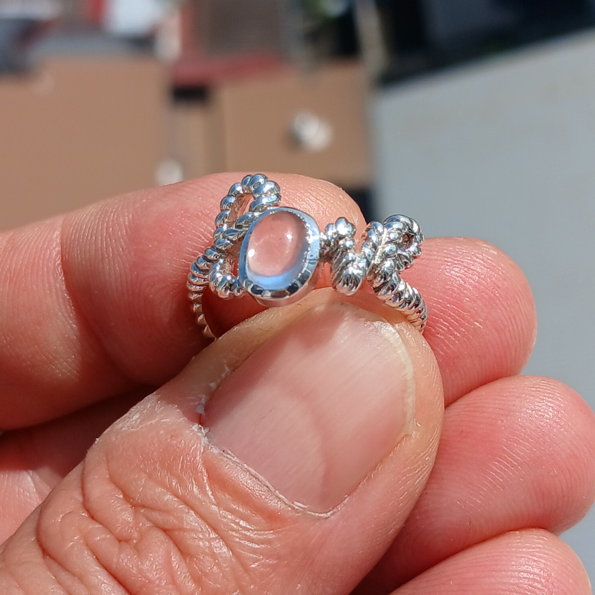 A beautiful Moonstone Silver Ring featuring an oval-shaped moonstone set in high-quality sterling silver with a mirror-polished finish.