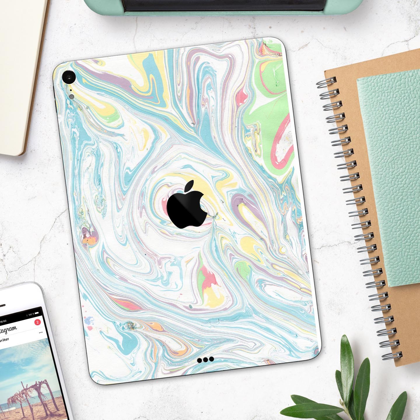 Marbleized Swirling Candy Colors skin decal for Apple devices, showcasing vibrant colors and a sleek design.