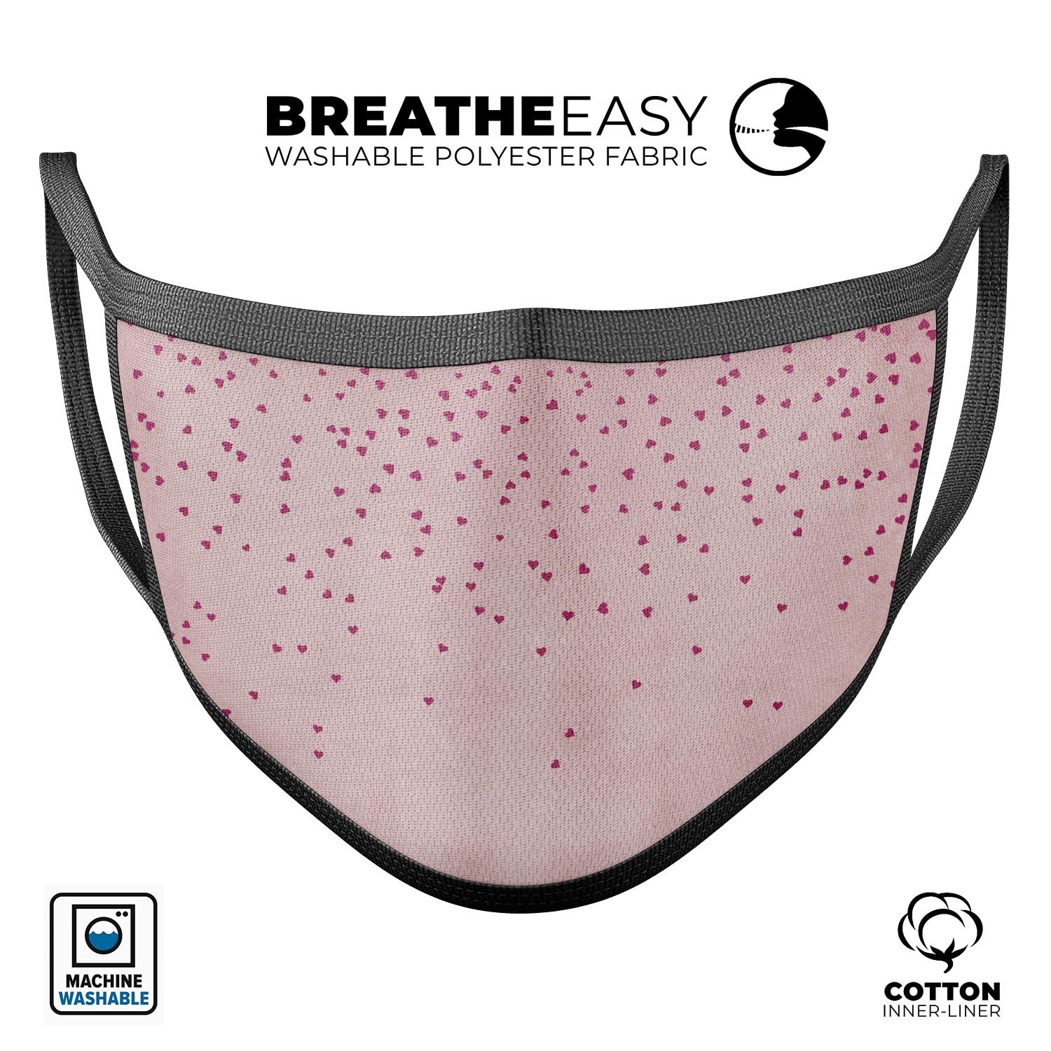 Mauve hearts design on pale pink watercolor reusable face mask, made in the USA, showcasing adjustable ear loops and soft cotton interior.