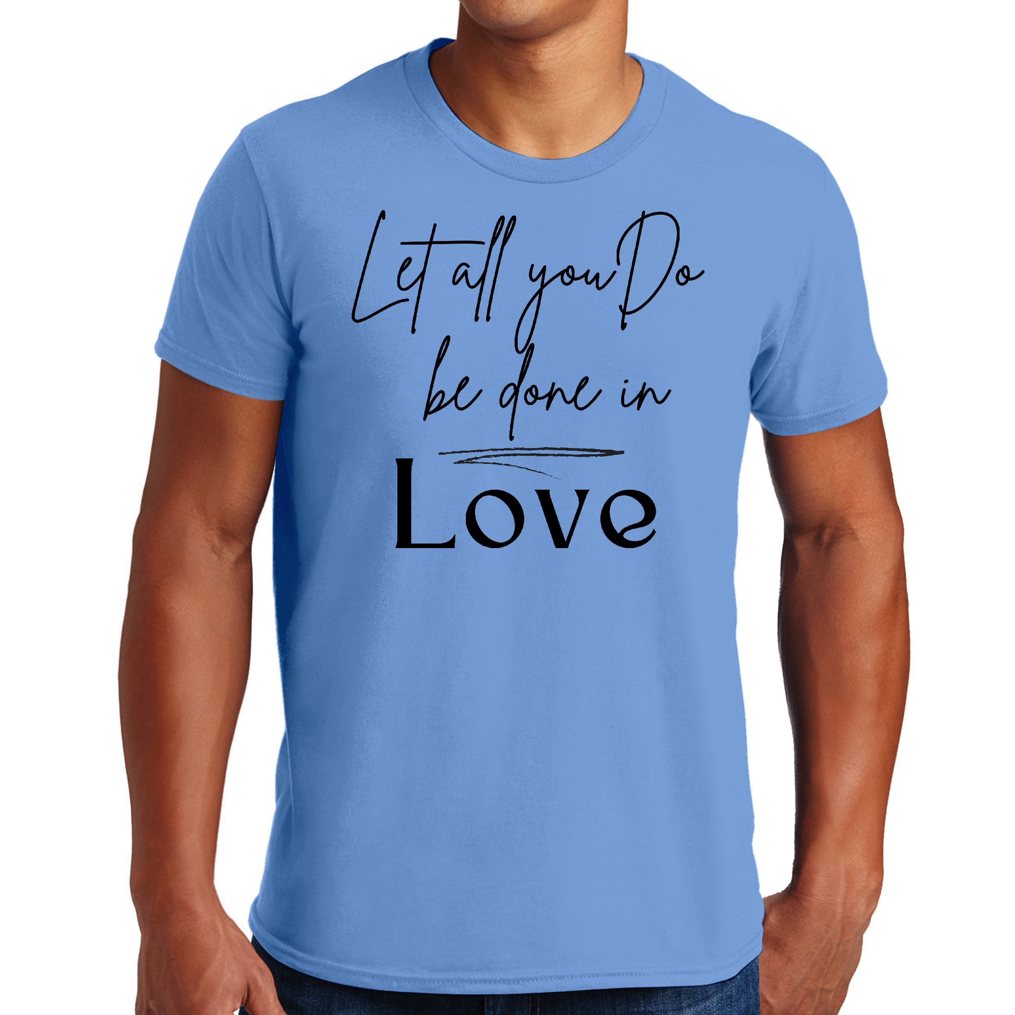 Men's black graphic T-shirt with the quote 'Let All You Do Be Done in Love' printed in white, showcasing a stylish and inspirational design.