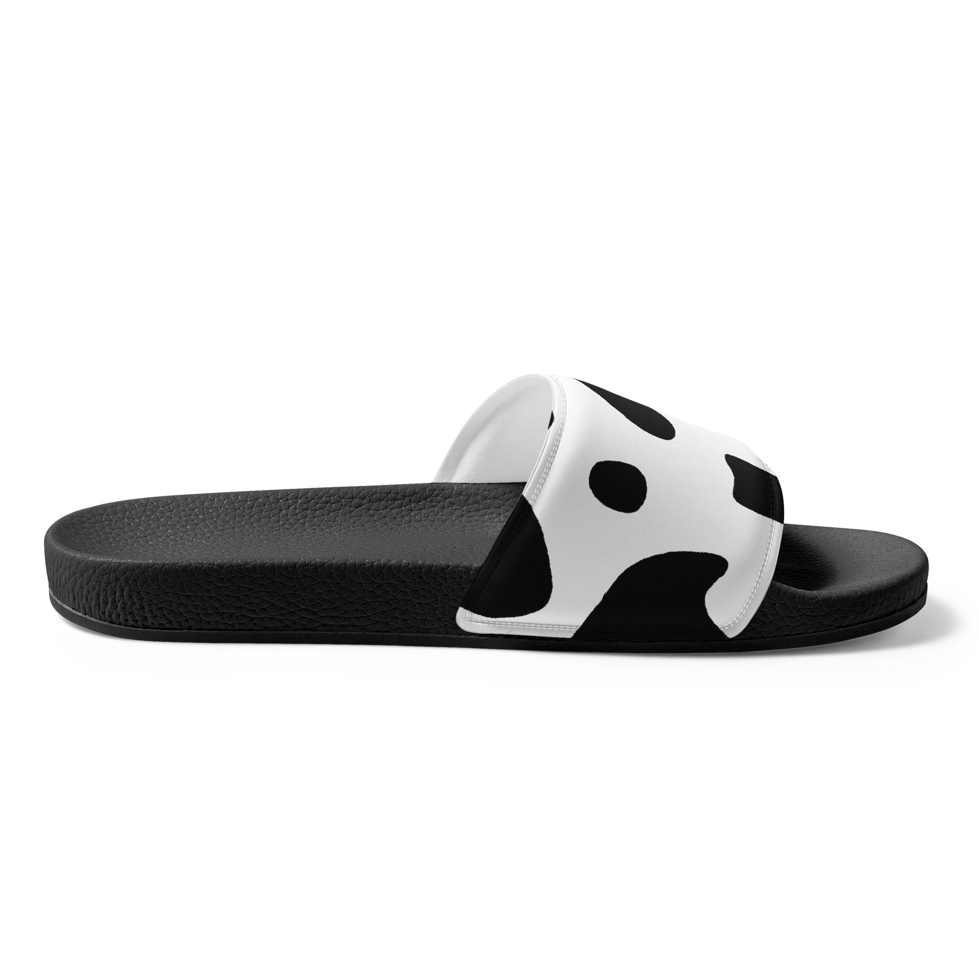 Men's slide sandals featuring a black and white abstract cow print pattern, designed for comfort and style.