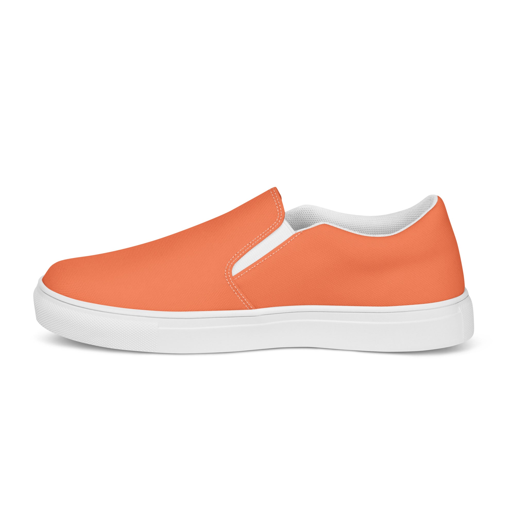 Men's slip-on canvas shoes in coral orange and red, featuring elastic side goring and a durable rubber sole.