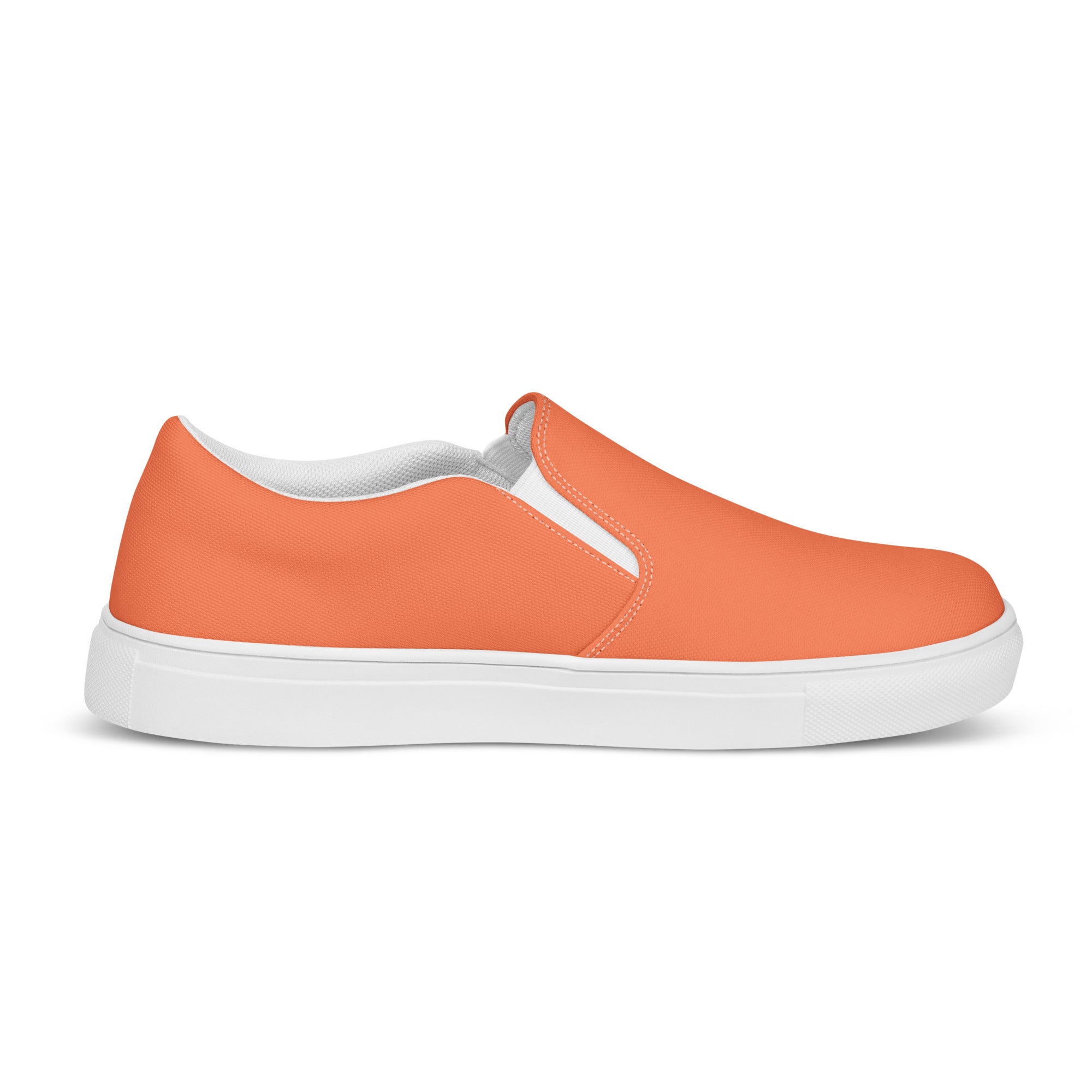 Men's slip-on canvas shoes in coral orange and red, featuring elastic side goring and a durable rubber sole.