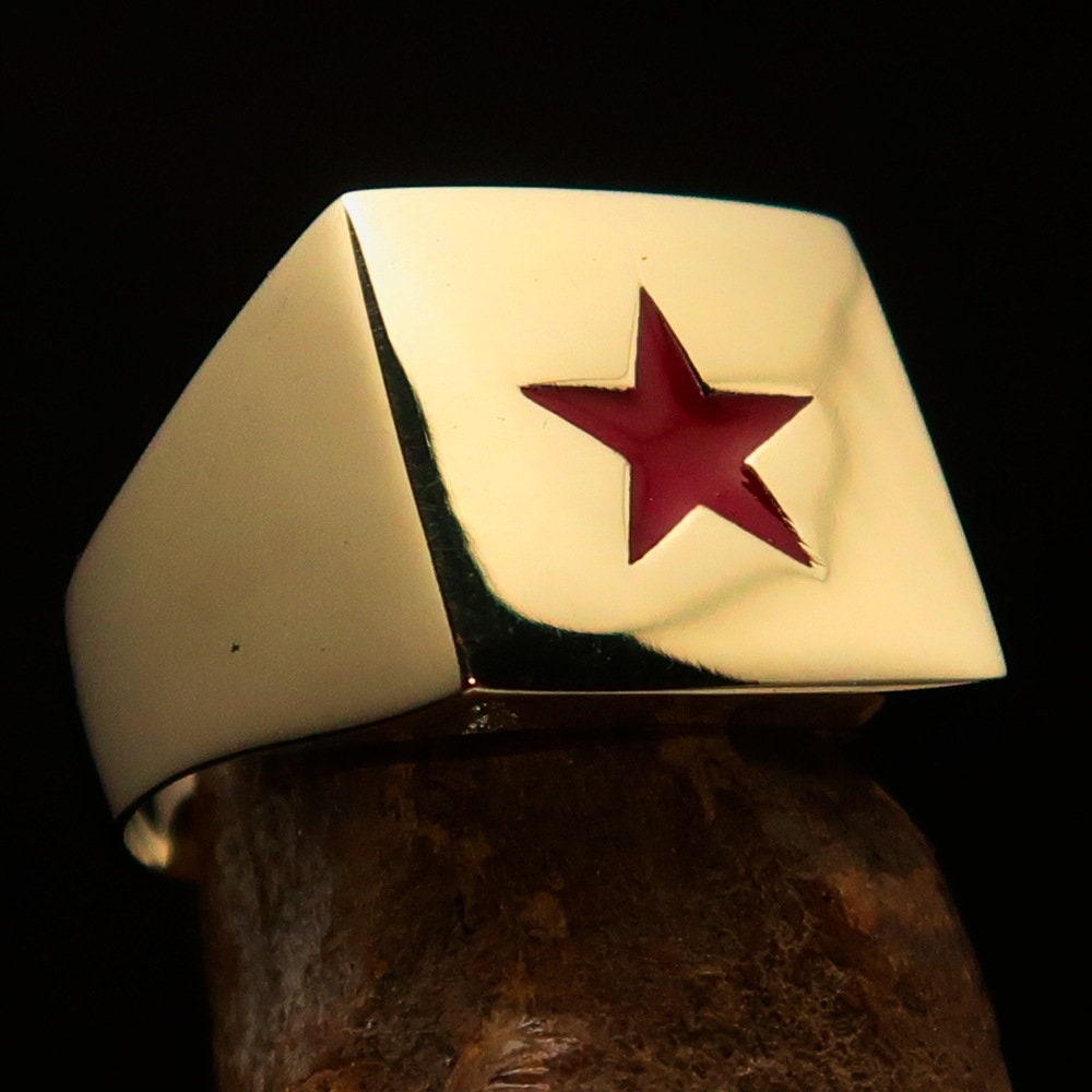 Men's Socialist Ring featuring a polished brass finish with a red star logo, square-shaped design, and RCRN engraving.