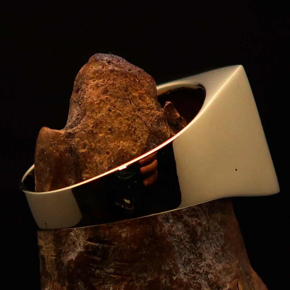 Men's Socialist Ring featuring a polished brass finish with a red star logo, square-shaped design, and RCRN engraving.