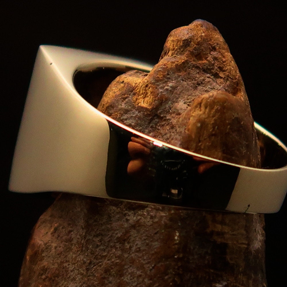 Men's Socialist Ring featuring a polished brass finish with a red star logo, square-shaped design, and RCRN engraving.