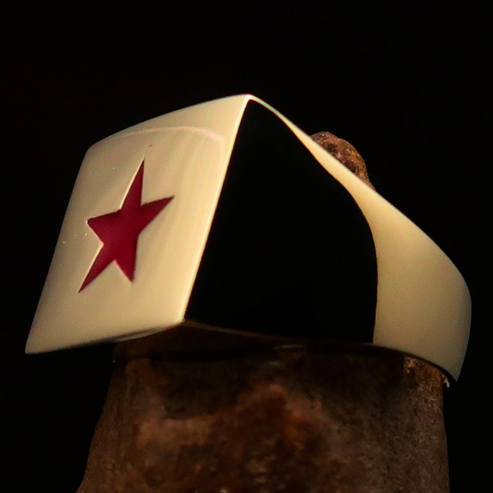 Men's Socialist Ring featuring a polished brass finish with a red star logo, square-shaped design, and RCRN engraving.