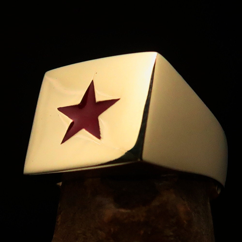 Men's Socialist Ring featuring a polished brass finish with a red star logo, square-shaped design, and RCRN engraving.