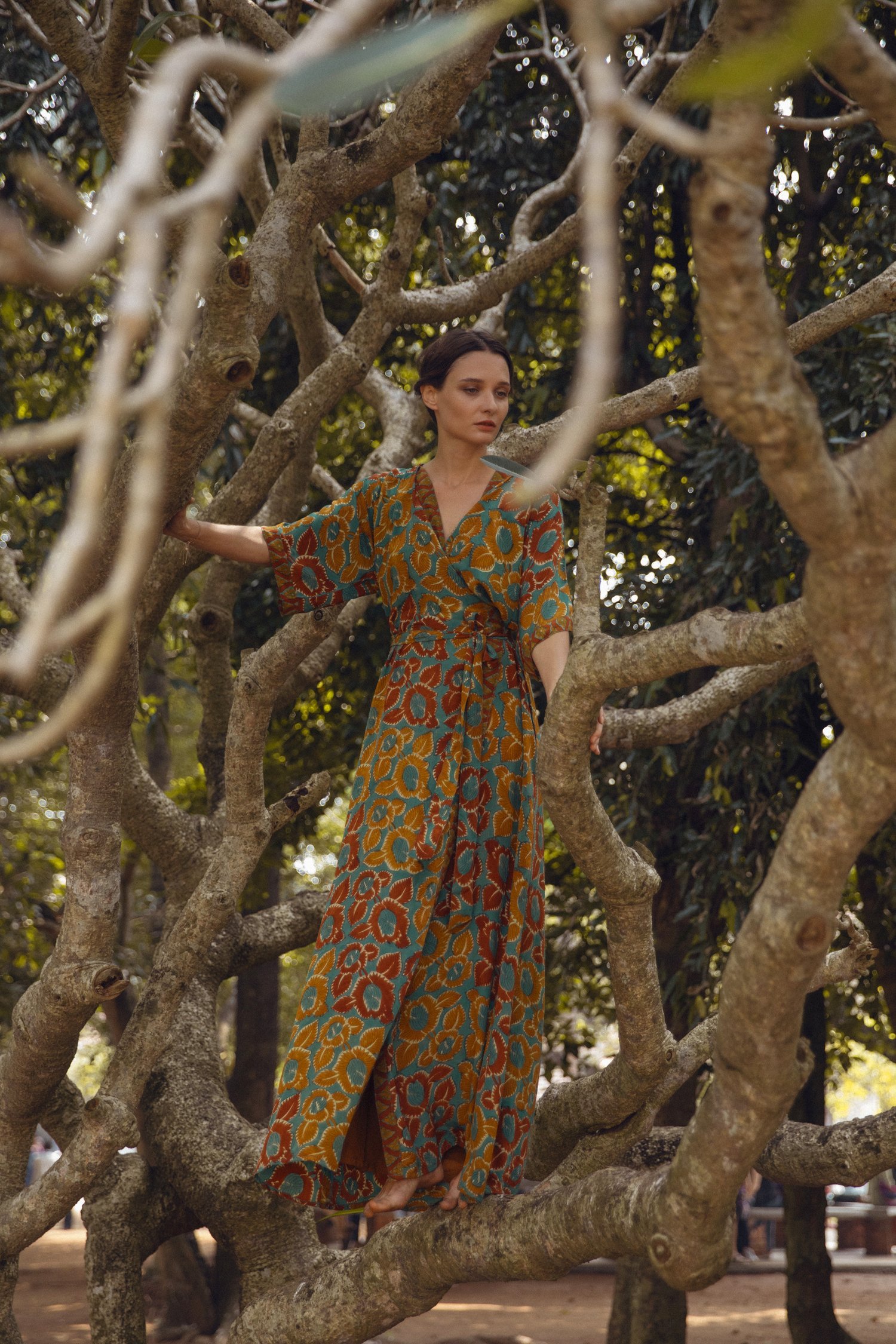 Mia belted wrap dress made from vintage silk, showcasing a beautiful silhouette and unique print.